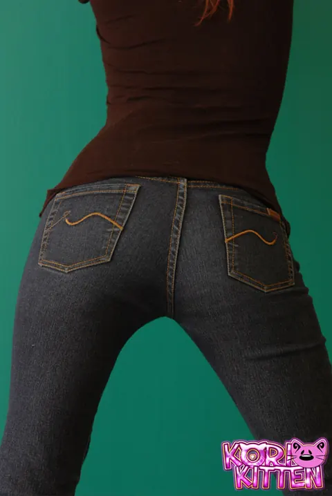 Korina Bliss: Slim Redhead in Jeans and Heels Reveals Her Big Tits – photo 1 of 12