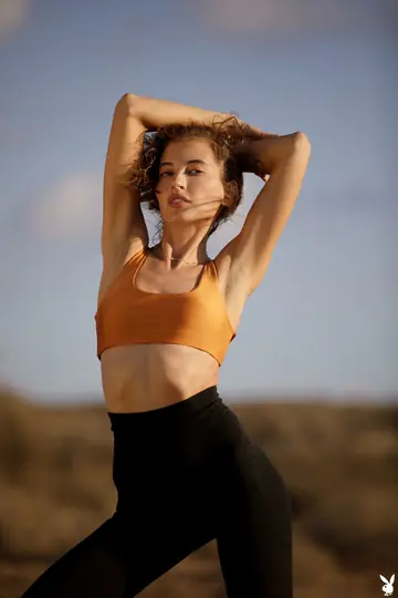 Slim Brunette Undresses and Poses Nude Outdoors