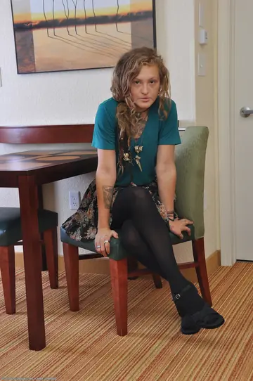 Curly-Haired Woman in Stockings Shows Her Hairy Pussy