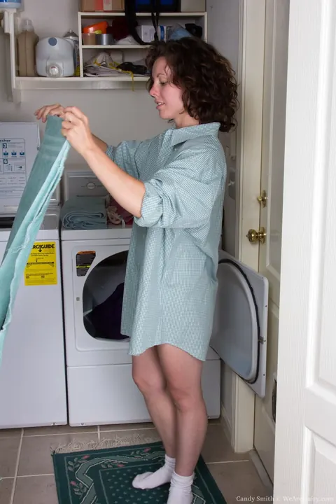 Candy Smith: Petite Curly Brunette Strips and Spreads in Laundry Room – photo 2 of 17