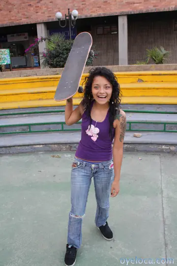 Curly Brunette Latina Shows Her Tattoos Outdoors