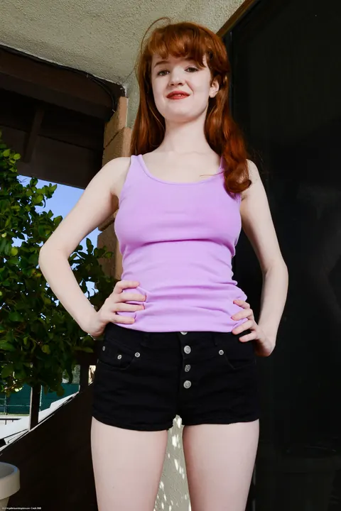 Abbey Rain: Petite Redhead with Big Natural Tits Strips and Poses – photo 2 of 21