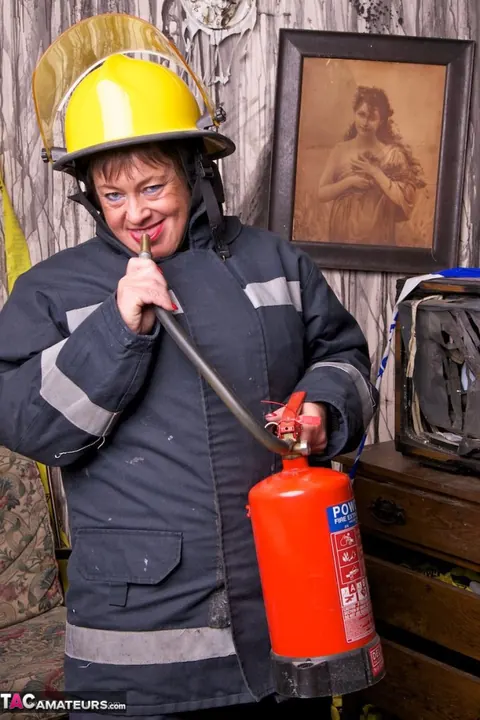 European MILF Strips Out of Her Firefighter Uniform – photo 6 of 20