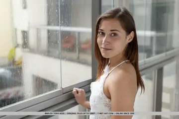 Brunette in a Skirt Spreads Her Shaved Pussy
