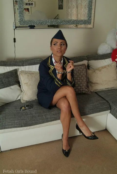 Flight Attendant MILF Strains in Handcuffs and High Heels – photo 8 of 16