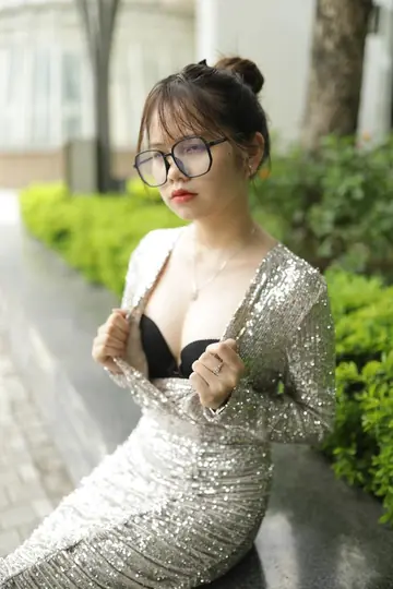 Slim Brunette with Big Tits and Glasses Poses Outdoors
