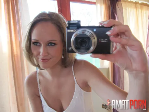 Redhead in a Skirt Strips for a Mirror Selfie – photo 1 of 15