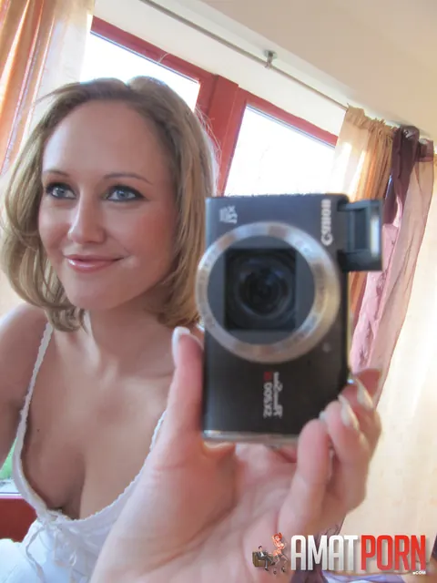 Redhead in a Skirt Strips for a Mirror Selfie – photo 2 of 15