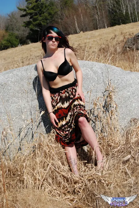 Amateur in Glasses Reveals Her Natural Tits by a Boulder in the Forest – photo 9 of 12