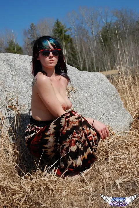 Amateur in Glasses Reveals Her Natural Tits by a Boulder in the Forest – photo 12 of 12