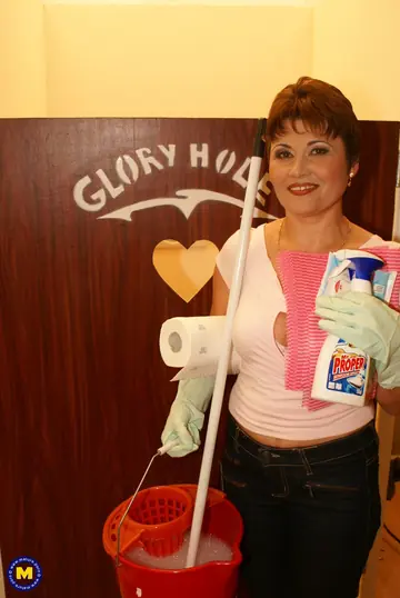 Malinda – Mature Redhead in a Thong Sucks Cock at the Gloryhole