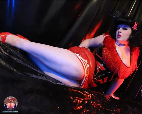 Busty Brunette Poses in a Latex Skirt and High Heels – photo 8 of 16