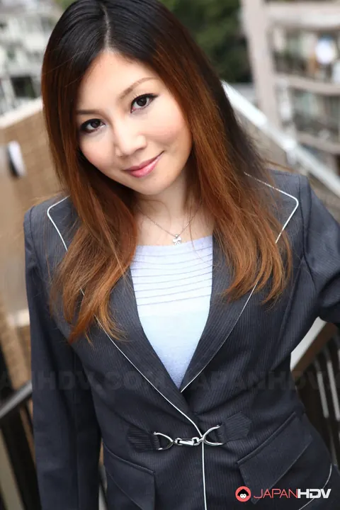 Yuria Kanno: Japanese MILF with Red Hair Poses Outdoors in Her Uniform – photo 3 of 15