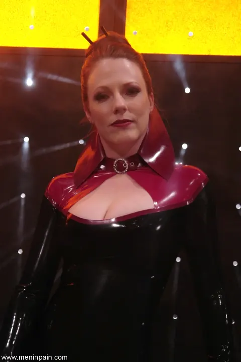 Lady Lydia McLane: Redhead in a Latex Skirt Dominates Her Partner in Bondage – photo 2 of 21
