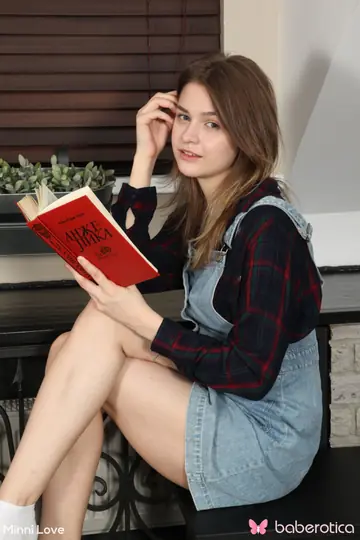 Redhead Reads a Book Before Stripping Naked and Spreading