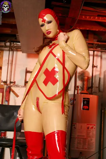 Tall Redhead MILF in Latex Uniform Spreads Her Pussy Lips