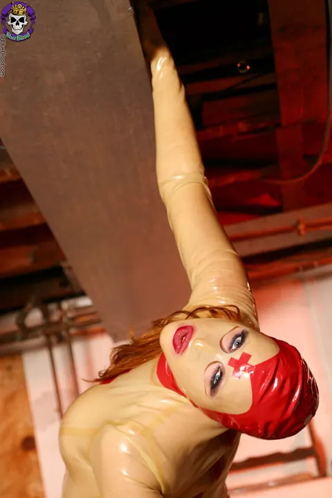 Julie Simone: Tall Redhead MILF in Latex Uniform Spreads Her Pussy Lips – photo 15 of 18