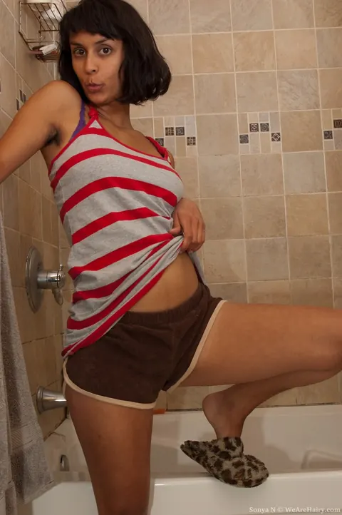 Sonya N: Slim Short-Haired Brunette Undresses in the Bathroom – photo 2 of 17