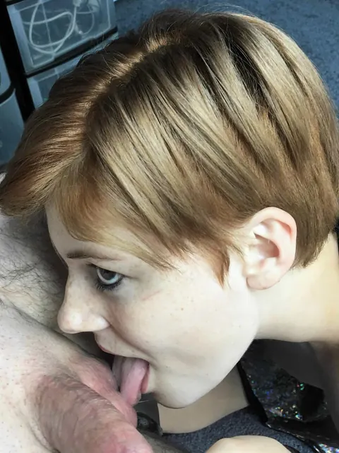 Short-Haired Redhead in a Bikini Gives a Blowjob – photo 2 of 21