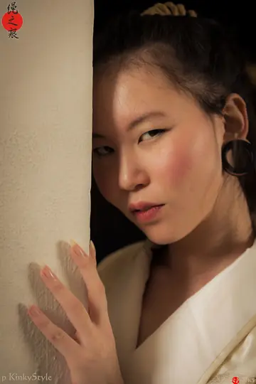 Asian Brunette Restrained with Rope in Shibari Session