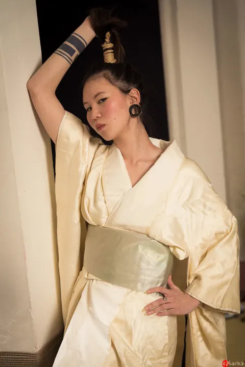Asian Brunette Restrained with Rope in Shibari Session – photo 14 of 16