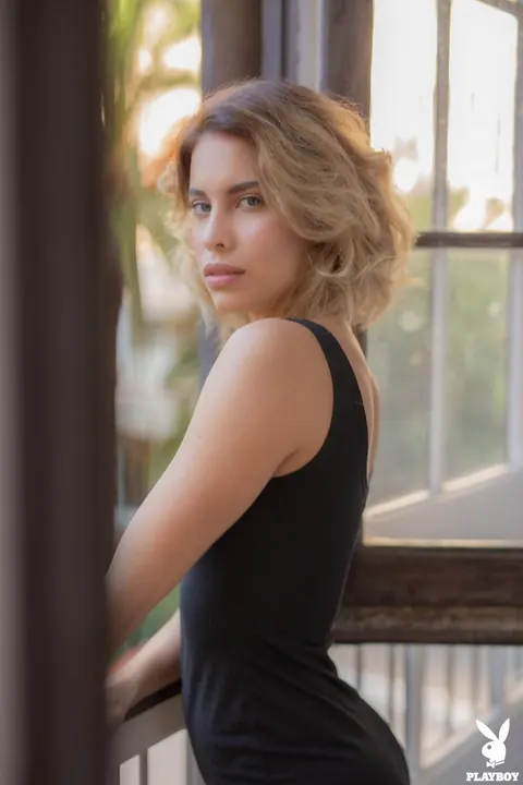 Toni Maria: Short-Haired Blonde Latina Shows Small Tits and Tattoo at the Window – photo 14 of 17
