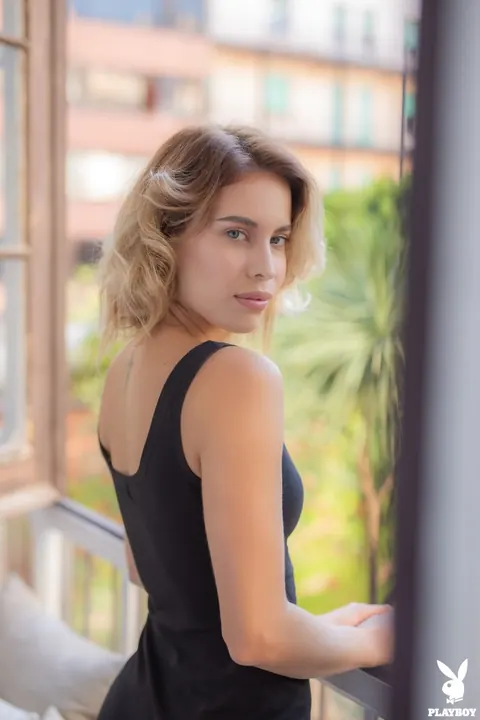 Toni Maria: Short-Haired Blonde Latina Shows Small Tits and Tattoo at the Window – photo 15 of 17