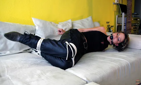 Hogtied Woman in Leather and High Heels Left on the Sofa – photo 13 of 16