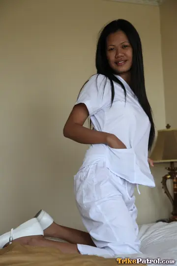 Asian Nurse Strips Off Her Uniform and Spreads Her Trimmed Pussy
