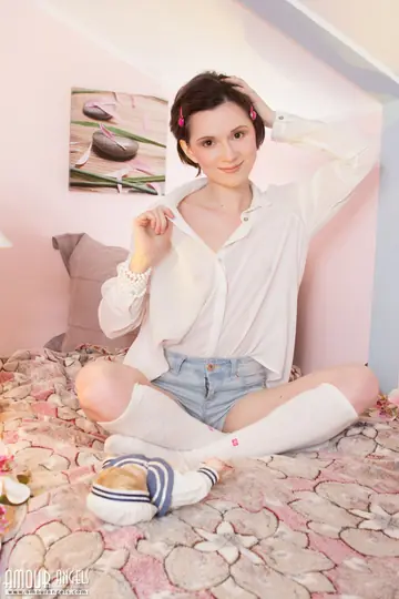 Short-Haired Brunette Strips Out of Her Shorts and Socks