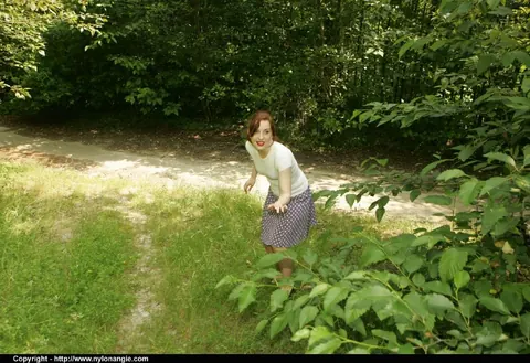 Dirty Angie: Slim Mature Redhead Lifts Her Skirt and Spreads Outdoors – photo 1 of 12