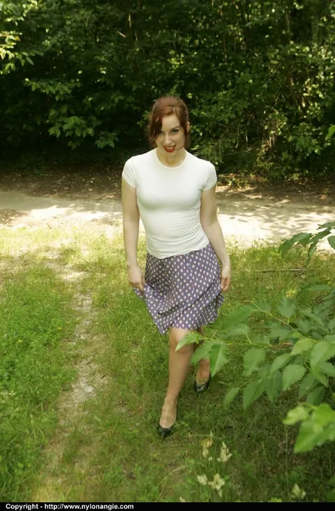 Dirty Angie: Slim Mature Redhead Lifts Her Skirt and Spreads Outdoors – photo 2 of 12