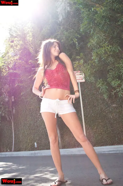 Jenny Lee: Brunette Unzips Her Shorts to Show Tattoo Outdoors – photo 9 of 15