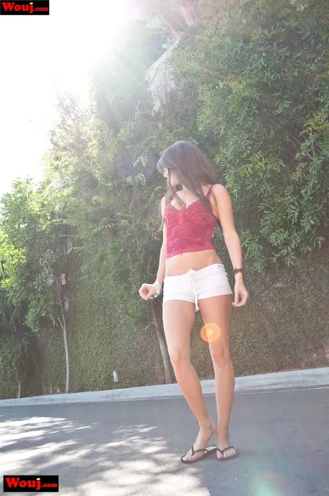 Jenny Lee: Brunette Unzips Her Shorts to Show Tattoo Outdoors – photo 7 of 15