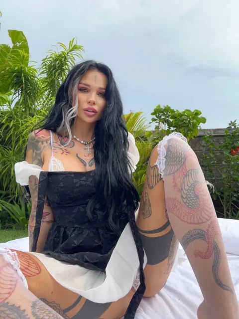 Slim Tattooed Brunette Spreads in a Skirt Outdoors – photo 7 of 10