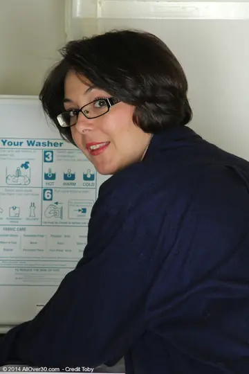 Carlita Johnson – Tattooed Mature Brunette Strips in Laundry Room and Spreads