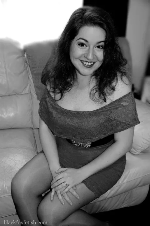 Redhead MILF Lifts Her Red Dress and Spreads Her Legs on Leather Sofa – photo 7 of 11
