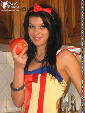 European Brunette Slips Hose-Covered Feet Out of Shoes in the Kitchen