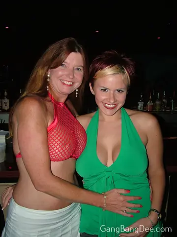 Busty Redhead MILF in a Skirt Licks Pussy in Group Action